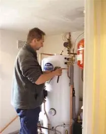 Expert plumbing services in Hampshire – fixing leaking pipe in residential home